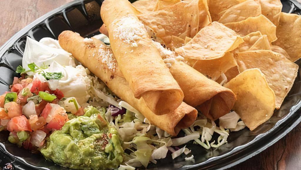 Chicken Taquitos · Three jumbo taquitos stuffed with chicken and black beans. Served with guacamole and sour cream.