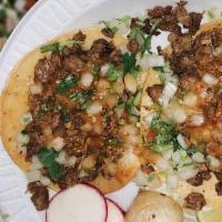 Tacos · Onions, cilantro, and salsa.