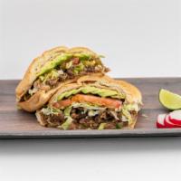 Tortas · Mexican bread. Served with refried beans, lettuce, mayonnaise, avocado, tomato, jalapeno, an...
