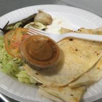 Cheese Quesadilla · Twelve inches flour tortilla, filled with cheese. Served with lettuce, tomato, guacamole, so...