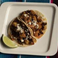 Soyrizo con Papas Tacos · Two Mexican Soy Chorizo and Potato Tacos Topped with Arbol Salsa and Queso Fresco.  Served o...
