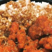 Spicy (sauce) Popcorn Chicken Bowl · Popcorn Chicken coated with Spicy Tapatío Sauce & seasoned with Basil over Rice with Teriyak...