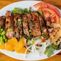 Pono's Asian Chicken Salad · Grilled Chicken teriyaki, spring greens, edamame, sweet onion, tomato, cucumber, carrot, pic...