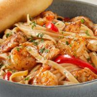 Cajun Shrimp & Chicken Pasta · Sauteed shrimp, chicken, red bell peppers, spicy Cajun Alfredo sauce, Parmesan-Romano, fettu...