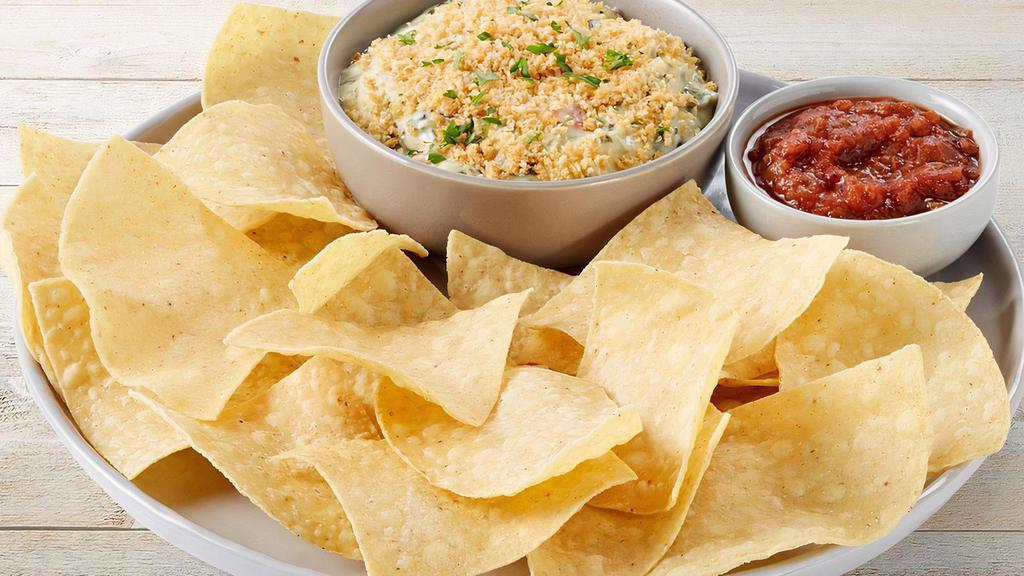 Spinach & Artichoke Dip · Spinach, artichokes, Romano, sauteed onions & red bell peppers. Topped with Parmesan bread crumbs and served with tortilla chips & salsa.