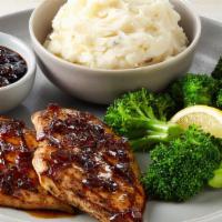 Fridays Signature Whiskey-Glazed Chicken · Signature Whiskey-Glaze over two grilled chicken breasts. Served with mashed potatoes and le...