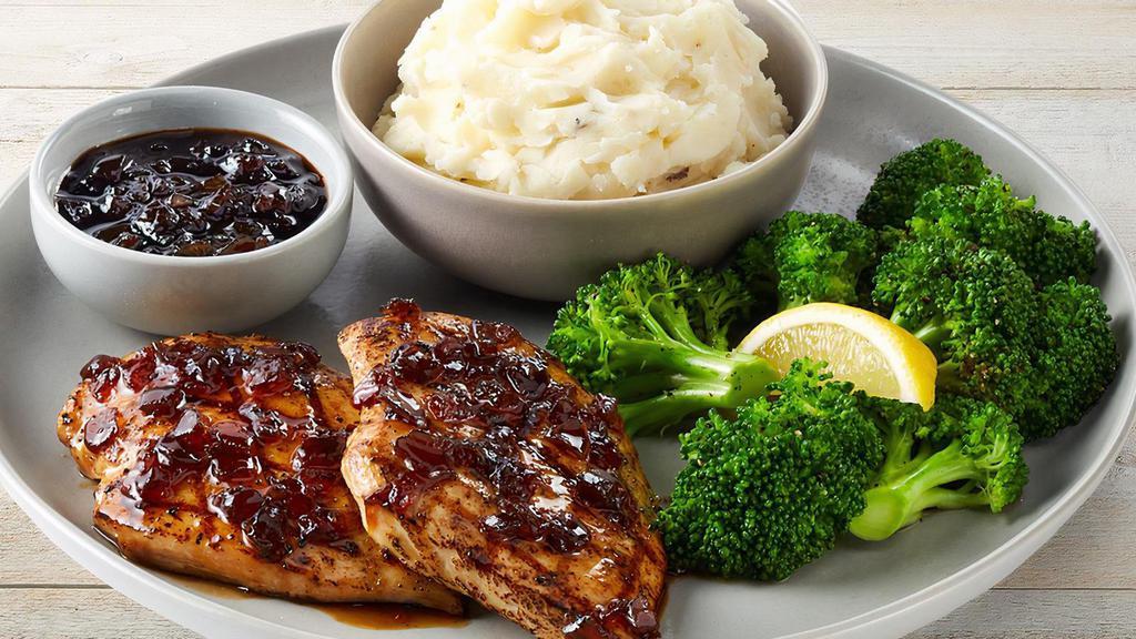 Fridays Signature Whiskey-Glazed Chicken · Signature Whiskey-Glaze over two grilled chicken breasts. Served with mashed potatoes and lemon-butter broccoli.
