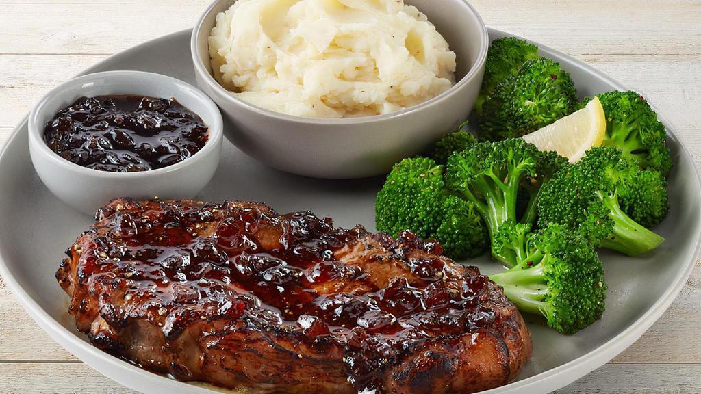 New York Strip Topped With Whiskey-Glaze · 12 ounce strip topped with our Signature Whiskey-Glaze. Served with mashed potatoes and lemon-butter broccoli.