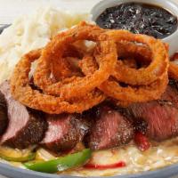 Sizzling Fridays Signature Whiskey-Glazed Flat Iron Steak · Soy-marinated flat iron steak, melted cheese, onions, red & green bell peppers, mashed potat...