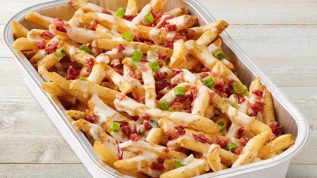 Mega Loaded Queso Fries · Shareable portion of our crispy fries with all the fixings to load ?em up. Queso, crispy bacon and green onions.