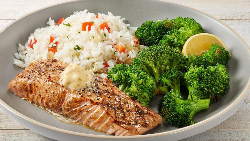 Simply Grilled Salmon · Seasoned with hickory-smoked sea salt and topped with Parmesan Butter. Served with lemon-butter broccoli and jasmine rice.