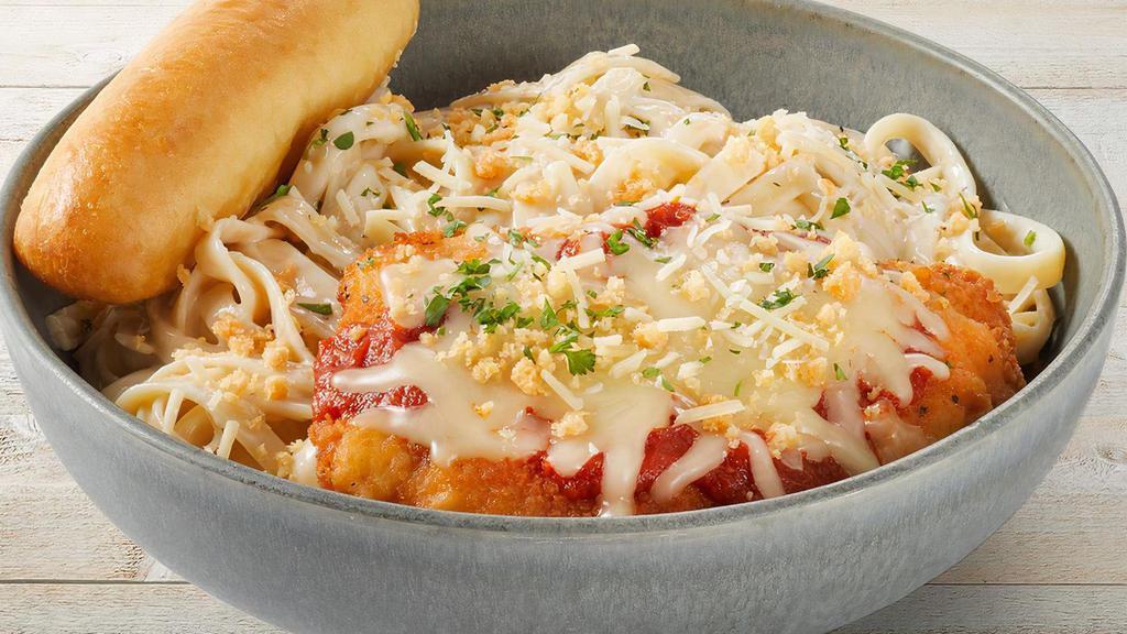 Chicken Parmesan Pasta · Crispy chicken breast with marinara and cheese on fettuccine Alfredo. Topped with Parmesan crisps. Served with a warm garlic breadstick.