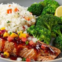Dragon-Glaze Salmon · Sweet and spicy glazed salmon topped with a fresh mango pico. Served with lemon-butter brocc...