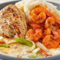 Sizzling Chicken & Shrimp · Garlic-marinated chicken breasts with shrimp tossed in marinara. Served over melted cheese w...
