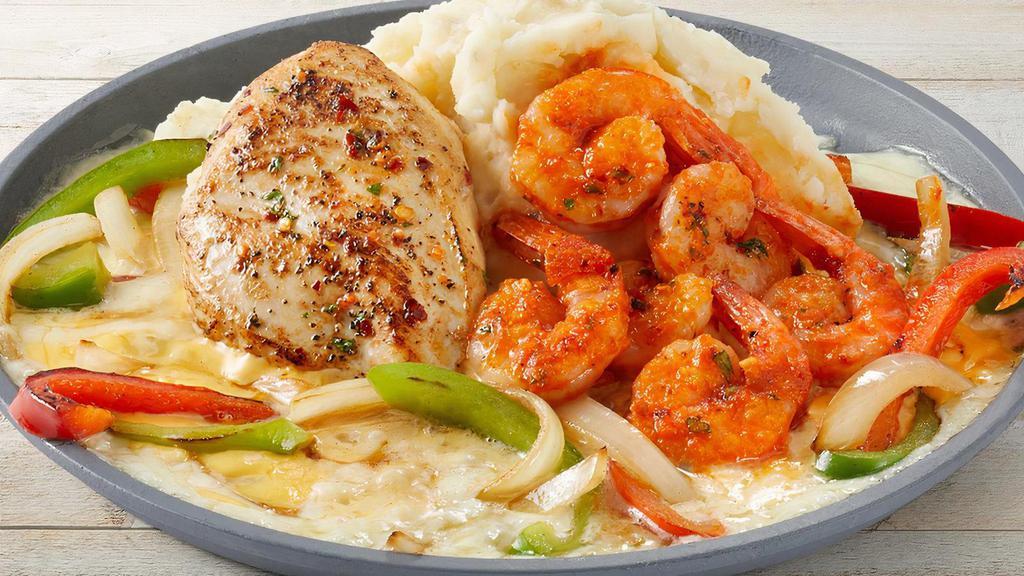 Sizzling Chicken & Shrimp · Garlic-marinated chicken breasts with shrimp tossed in marinara. Served over melted cheese with onions, red & green bell peppers and mashed potatoes.
