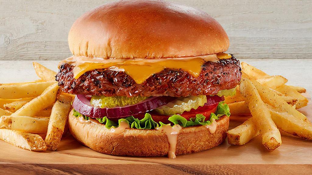 The Beyond Meat Cheeseburger · Made from plant-based ingredients, this juicy, mouthwatering burger satisfies like beef. Our patty is seasoned and grilled with cheddar, lettuce, tomato, red onions, pickles and FRIDAYS sauce.