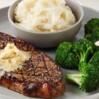New York Strip · 12 ounce strip topped with Parmesan Butter. Served with mashed potatoes and lemon-butter bro...