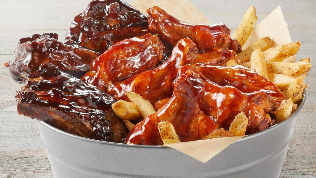 Bucket Of Bones · FRIDAYS BIG RIBS and traditional wings served with seasoned fries. Choose your rib sauce and choose your wing sauce.