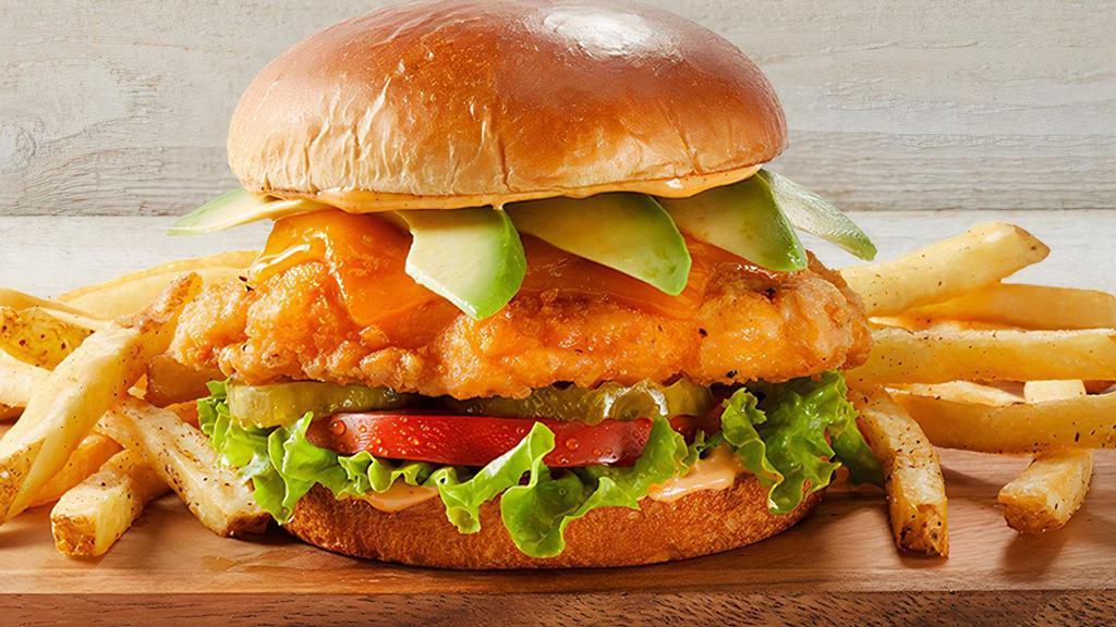 Southern Fried Chicken Sandwich · Battered chicken breast, lettuce, tomato, pickles, avocado, cheddar & spicy aioli.