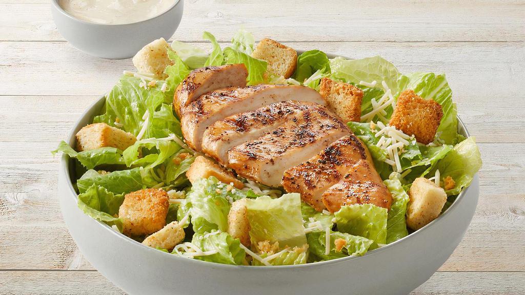 Caesar Salad With Grilled Chicken · Grilled chicken, romaine, Parmesan-Romano, Caesar dressing, Asiago croutons and Parmesan crisps.