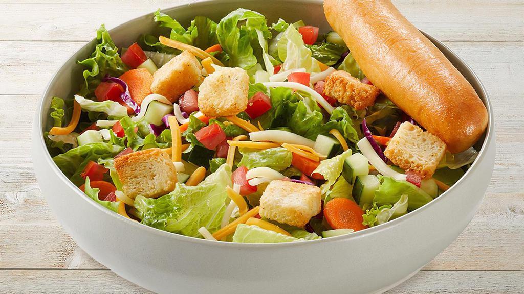 House Salad · Mixed greens, sliced carrots, red cabbage, tomatoes, cucumber, mixed cheese and Asiago croutons with choice of dressing on the side and a warm garlic breadstick.