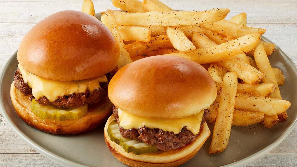 Kid'S Sliders · 2 USDA Choice beef burgers with American Cheese and pickles on soft mini buns Served with kid's side choice.
