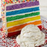 Carlo'S Bakery Rainbow Cake · Six layers of rainbow-colored vanilla cake filled high with a sweet vanilla icing and covere...