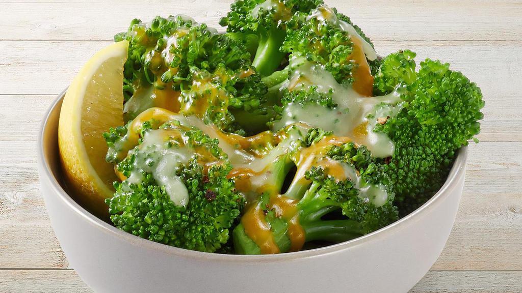 Lemon-Butter Broccoli & Cheese · Fresh steamed broccoli with Parmesan Butter and lemon topped with mixed cheese.