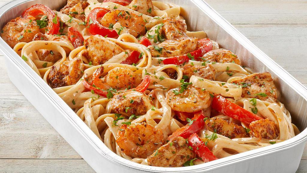 Cajun Shrimp & Chicken Pasta Party Tray · Sauteed shrimp, chicken, red bell peppers, spicy Cajun Alfredo sauce, Parmesan-Romano and fettuccine.