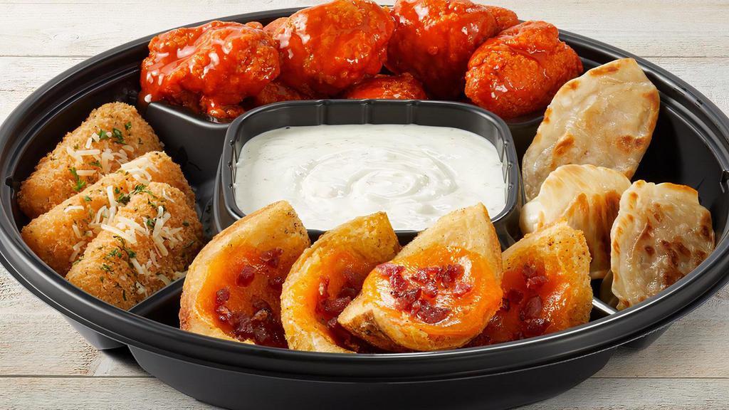 Classic Fridays App Platter - Small · Choice of Wings (traditional or boneless), Loaded Potato Skins, Mozzarella Sticks and Pan-Seared Pot Stickers.