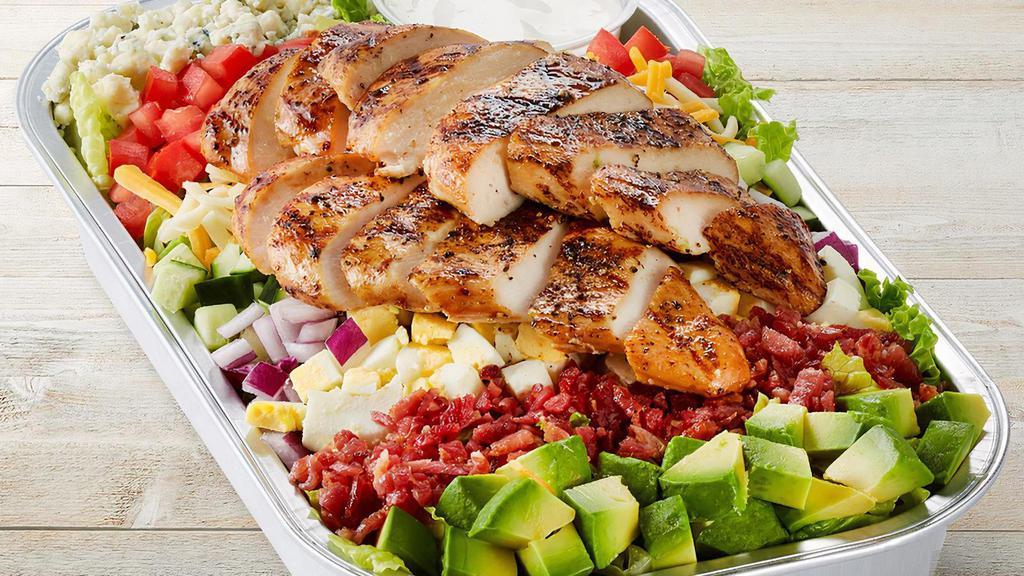 Million Dollar Cobb With Chicken Party Tray · Grilled chicken, mixed greens, carrots, red cabbage, avocado, tomatoes, chopped cage-free egg, bacon, blue cheese, red onions, cucumber, Jack cheese and cheddar. Ranch dressing on the side and choice of half-gallon beverage. Serves 4-6.