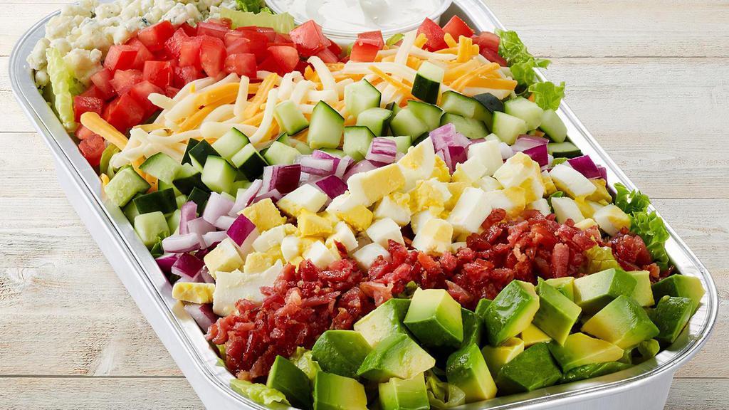 Million Dollar Cobb Party Tray · Mixed greens, carrots, red cabbage, avocado, tomatoes, chopped cage-free egg, bacon, blue cheese, red onions, cucumber, Jack cheese, cheddar & Ranch dressing on the side.