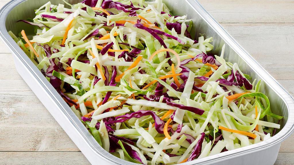 Slaw Party Tray · Slaw mix of red and green cabbage, shredded carrots, and fresh spinach tossed in creamy coleslaw dressing. Serves 2-3.