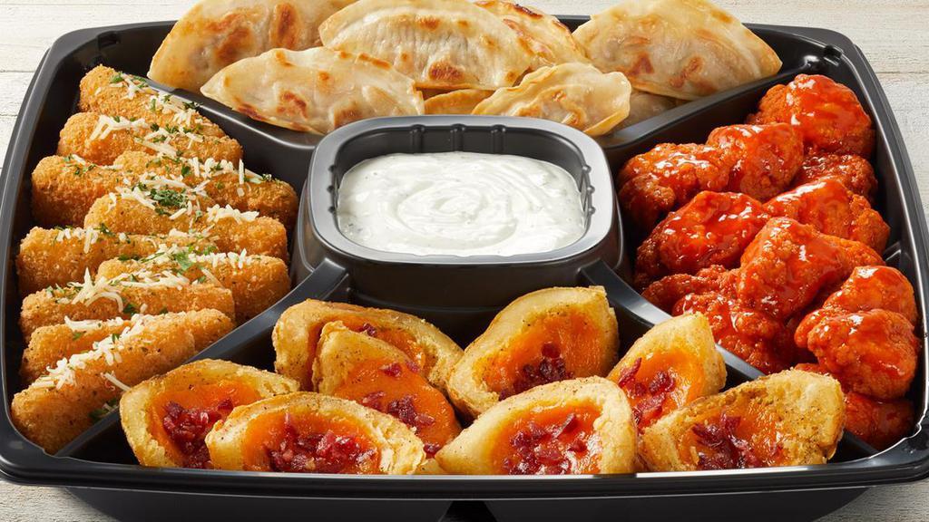 Classic Fridays App Platter - Large · Choice of Wings (traditional or boneless), Loaded Potato Skins, Mozzarella Sticks and Pan-Seared Pot Stickers.