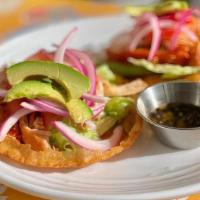 Salbutes (2) · Yucatecon tostadas topped with shredded chicken, lettuce, tomatoes, pickled red onion, avoca...