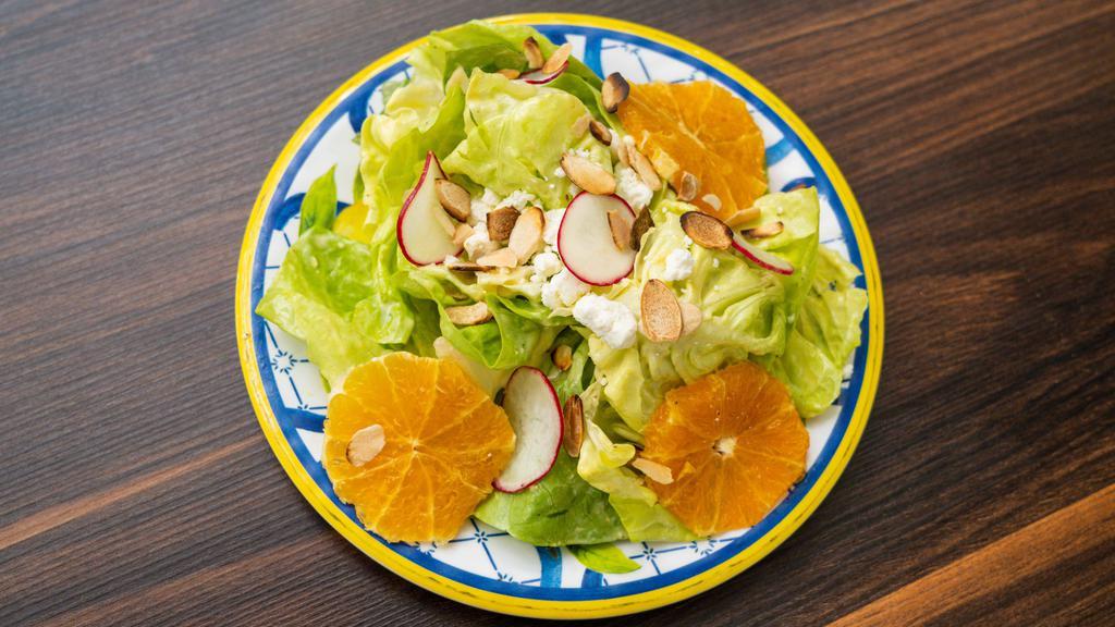 Seasonal Salad · Organic Butter Lettuce, Radish, Pomegranate Seeds, Almonds, Goat Cheese & EVOO Lemon Dressing