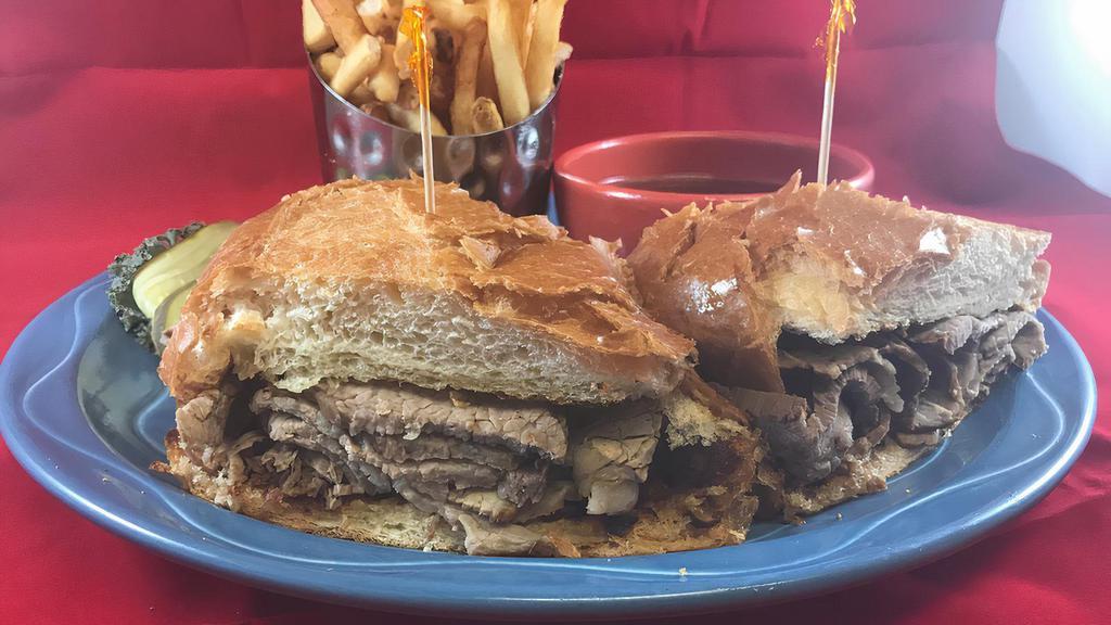 French Dip · Grilled seasoned roast beef on a garlic French roll with au jus