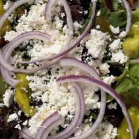 Greek Salad · Spring mix with kalamata olives, tomatoes, cucumbers, red onion, pepperoncini and feta cheese.