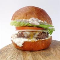 Eggplant Dip Burger · A juicy burger made from a unique blend of premium cuts of chuck & brisket with melted chedd...