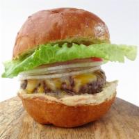 Hummus Dip Burger · A juicy burger made from a unique blend of premium cuts of chuck & brisket with melted chedd...