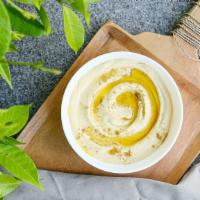 Classic Hummus Dip · Homemade plain creamy hummus dip (chickpeas, garlic, lemon, tahini & olive oil). Contains se...