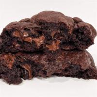 Triple Choc Cookies · A box of four soft, giant chocolate cookies filled with a medley of melty pools of dark choc...