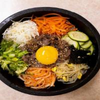 Bibimbab · Meat and assorted vegetable with fried egg over rice choice of beef, pork or chicken.