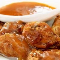 Chicken Wings · Fresh chicken wings smothered in your favorite house made sauce.