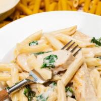 Alfredo Chicken Pasta
 · Hearty grilled chicken and house made creamy alfredo sauce served over a bed of fresh pasta .
