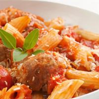 Meatball Pasta · Juicy meatballs topped with house made marinara sauce and served over a bed of fresh pasta .