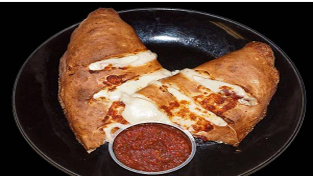 Vegetarian Calzone · Vegetarian. Tomato sauce, Mozzarella cheese, mushrooms, bell peppers, red onions, and black olives.