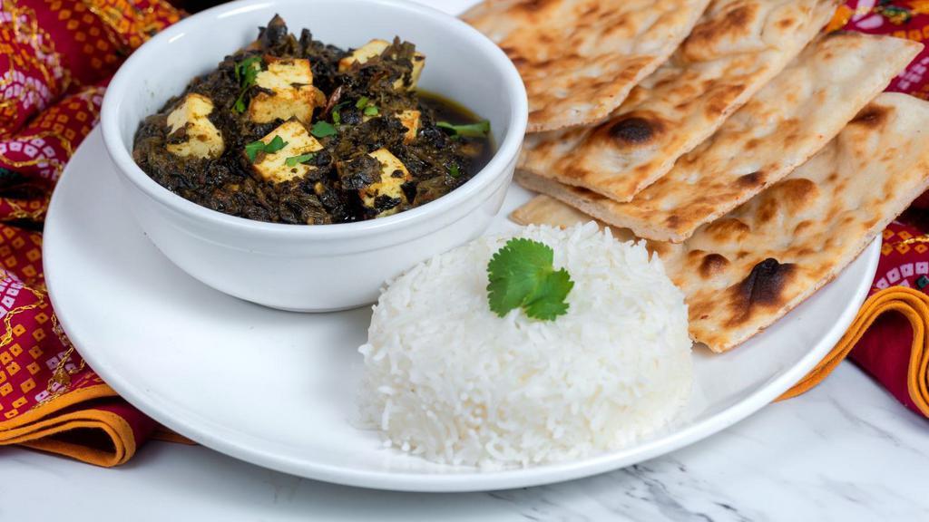 Palak Paneer · Veggie. Spicy spinach mixture with paneer cubes. Served with basmati rice and naan.