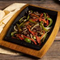 Sizzling Black Pepper Steak · Mirchi’s favorite. Grilled 8 oz. Harris ranch NY steak served on a sizzling plate with onion...