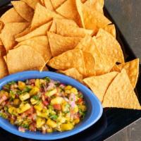 Mango Salsa & Chips · Diced mangos, red onions, jalapeños, cilantro, tomatoes and garlic. Tossed with lime juice. ...
